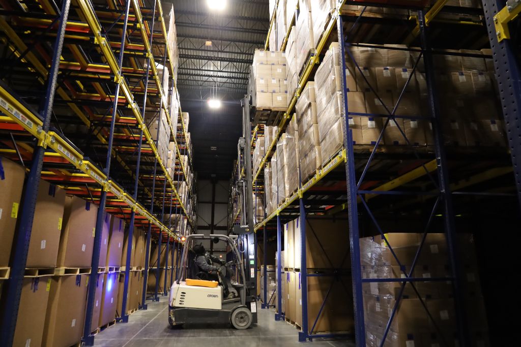 Forklift operator in the Mid Eastern Cold Storage warehouse racking system
